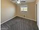 Neutral bedroom with a window and closet and carpet floors at 24811 W Wayland Dr, Buckeye, AZ 85326