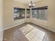 Bright dining area with a large window, neutral walls and a modern chandelier at 24811 W Wayland Dr, Buckeye, AZ 85326