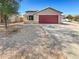 Charming single-story home featuring a desert landscape, wide driveway and a two car garage at 24811 W Wayland Dr, Buckeye, AZ 85326