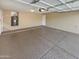 Spacious garage with an epoxy floor and plenty of room for parking and storage at 24811 W Wayland Dr, Buckeye, AZ 85326