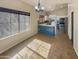 Open-concept kitchen, showcasing quartz countertops, stainless appliances, and breakfast nook with natural light at 24811 W Wayland Dr, Buckeye, AZ 85326