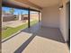 Covered patio perfect for outdoor entertaining and relaxation, featuring pavers and synthetic grass at 24811 W Wayland Dr, Buckeye, AZ 85326