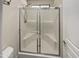 Beautiful bathroom shower with glass doors and built-in seating adds function and elegance at 24811 W Wayland Dr, Buckeye, AZ 85326