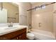 Bathroom featuring a vanity, toilet, and bathtub with shower at 26080 N 73Rd Ln, Peoria, AZ 85383
