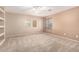 Large bedroom with carpet, ceiling fan, natural light, and built-in shelving at 26080 N 73Rd Ln, Peoria, AZ 85383