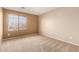 Empty bedroom featuring a window allowing ample natural light at 26080 N 73Rd Ln, Peoria, AZ 85383