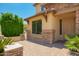 Close up view of a home featuring stone accents and a paver walkway to the front door at 26080 N 73Rd Ln, Peoria, AZ 85383