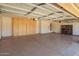 Spacious garage with cabinets for storage and finished flooring at 26080 N 73Rd Ln, Peoria, AZ 85383