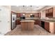Beautiful kitchen with granite countertops, stainless steel appliances, and large island at 26080 N 73Rd Ln, Peoria, AZ 85383