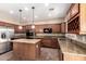 Well-equipped kitchen features granite counters, a central island, and stainless appliances at 26080 N 73Rd Ln, Peoria, AZ 85383