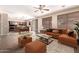 Open-concept living room flows into the dining area and kitchen with modern fixtures and finishes at 26080 N 73Rd Ln, Peoria, AZ 85383
