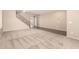 Spacious living area featuring neutral carpet and staircase with decorative iron at 26080 N 73Rd Ln, Peoria, AZ 85383