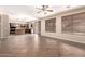 Open concept living room showcases the kitchen and dining areas, with bright light at 26080 N 73Rd Ln, Peoria, AZ 85383