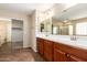 Spacious bathroom with dual sinks, large mirror, and separate tub and shower at 26080 N 73Rd Ln, Peoria, AZ 85383