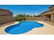 Backyard featuring a refreshing pool and desert landscaping at 26080 N 73Rd Ln, Peoria, AZ 85383