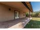 Inviting covered patio off of home overlooking a spacious green backyard with mature landscaping at 2807 N 8Th Ave, Phoenix, AZ 85007