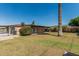 Expansive backyard featuring lush grass, mature landscaping, and covered patio area perfect for entertaining at 2807 N 8Th Ave, Phoenix, AZ 85007