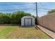 Spacious backyard with lush green grass, storage shed, and mature trees providing great space and privacy at 2807 N 8Th Ave, Phoenix, AZ 85007