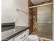 Modern bathroom featuring granite countertop and tiled shower with glass doors at 2807 N 8Th Ave, Phoenix, AZ 85007
