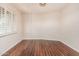 Cozy bedroom with hardwood flooring and ample natural light from the window at 2807 N 8Th Ave, Phoenix, AZ 85007