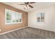 Bedroom featuring neutral walls and carpeting and multiple windows with white shutters at 2807 N 8Th Ave, Phoenix, AZ 85007