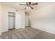 Bedroom with neutral walls and carpeting features closet and ceiling fan with light at 2807 N 8Th Ave, Phoenix, AZ 85007