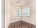 Dining room featuring wood floors, chandelier, and plantation shutters for bright, natural light at 2807 N 8Th Ave, Phoenix, AZ 85007