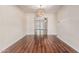 Formal dining room with hardwood floors and decorative lighting fixtures, transitioning to another living space at 2807 N 8Th Ave, Phoenix, AZ 85007