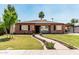 Charming brick home with a well-manicured lawn and inviting walkway leading to the front door at 2807 N 8Th Ave, Phoenix, AZ 85007