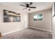 Neutral bedroom with carpet, ceiling fan, and natural light from a window at 3012 W Butler Dr, Phoenix, AZ 85051