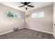 Bedroom features neutral tones, plush carpet, and ample natural light from multiple windows at 3012 W Butler Dr, Phoenix, AZ 85051
