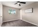 Bedroom featuring carpet, ceiling fan, natural light from the window and neutral paint at 3012 W Butler Dr, Phoenix, AZ 85051