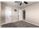 Bedroom with neutral paint, soft carpeting, closet space, and ceiling fan at 3012 W Butler Dr, Phoenix, AZ 85051