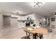 Open floor plan featuring a modern kitchen with white cabinets and updated appliances at 3012 W Butler Dr, Phoenix, AZ 85051