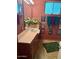 Retro bathroom with pink tile, decorative mirror, and coordinating accessories at 333 W Seldon Ln, Phoenix, AZ 85021
