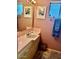 Tiled bathroom features vintage pink tile vanity and ample natural light at 333 W Seldon Ln, Phoenix, AZ 85021