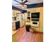 Functional kitchen with dual refrigerators, built-in appliances, and linoleum floors at 333 W Seldon Ln, Phoenix, AZ 85021