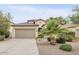 Charming single-story home featuring a well-manicured front yard and a two-car garage at 36199 W Prado St, Maricopa, AZ 85138