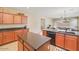 Well-lit kitchen with island, granite countertops, and open layout, perfect for entertaining at 36199 W Prado St, Maricopa, AZ 85138