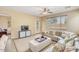 Cozy living room featuring a sectional sofa and ample natural light at 36199 W Prado St, Maricopa, AZ 85138