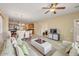 Open-concept living room flowing into the dining area and kitchen at 36199 W Prado St, Maricopa, AZ 85138