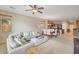 Comfortable living room with plush seating, open to the dining area and kitchen at 36199 W Prado St, Maricopa, AZ 85138