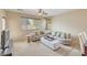 Comfortable living room with a large sectional sofa and neutral decor at 36199 W Prado St, Maricopa, AZ 85138