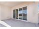 A covered patio features sliding glass doors to the home's interior at 40816 W Sunland Dr, Maricopa, AZ 85138