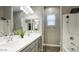 Modern bathroom with double sinks, a shower, and a bright, clean aesthetic at 40816 W Sunland Dr, Maricopa, AZ 85138