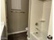 Bathroom featuring a white bathtub and tile flooring at 40816 W Sunland Dr, Maricopa, AZ 85138
