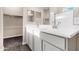 Contemporary double sink vanity in the bathroom, offering ample space and storage for a luxurious feel at 40816 W Sunland Dr, Maricopa, AZ 85138