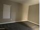 Neutral bedroom with a window and plush carpeting at 40816 W Sunland Dr, Maricopa, AZ 85138