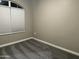 Bedroom features neutral walls, carpet, and a window with white blinds at 40816 W Sunland Dr, Maricopa, AZ 85138