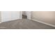 Bedroom featuring neutral walls, carpet floors, an outlet, and white closet doors at 40816 W Sunland Dr, Maricopa, AZ 85138